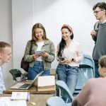 students talking each other in a class