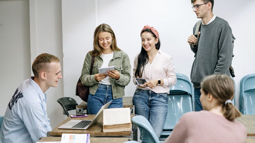 students talking each other in a class