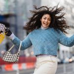 happy girl with bags after shopping