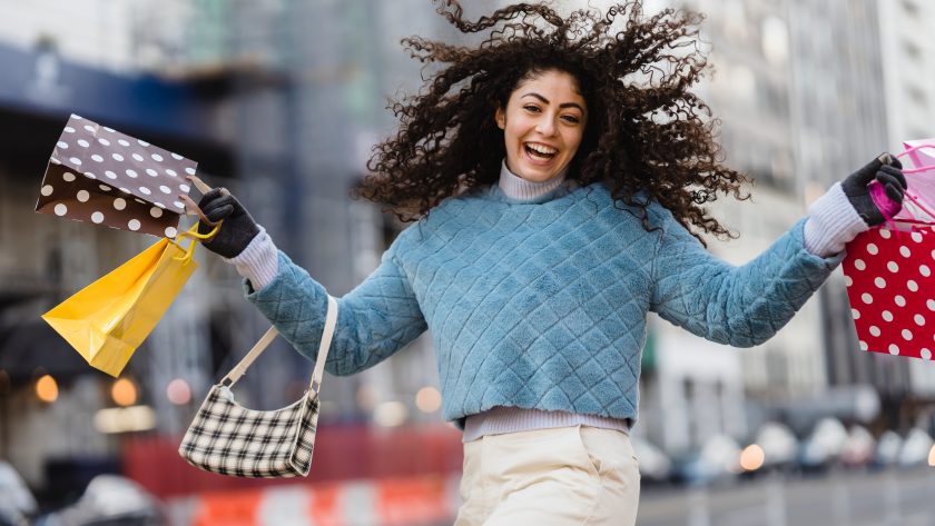 happy girl with bags after shopping