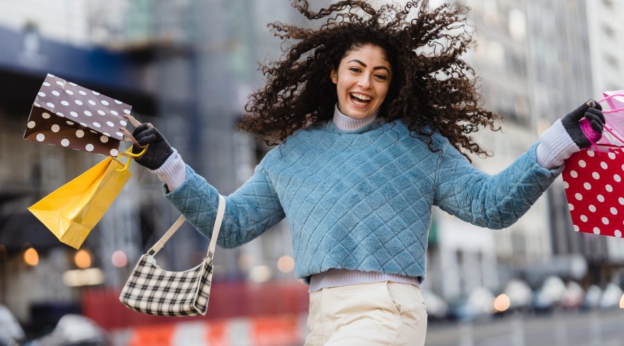 happy girl with bags after shopping